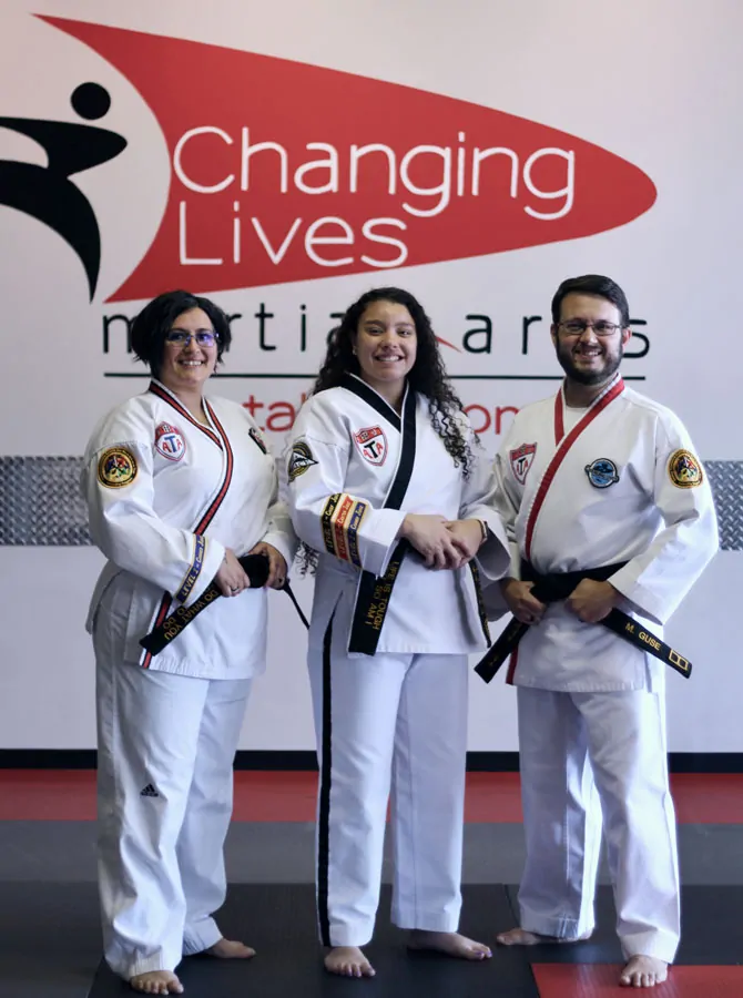 Changing Lives Martial Arts instructors standing together in a welcoming dojo