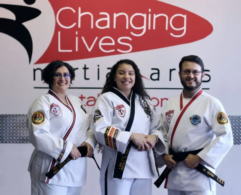 Changing Lives Martial Arts instructor team supporting students