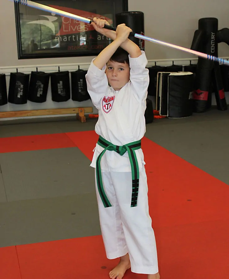 Children practicing together in a supportive martial arts environment